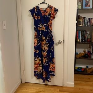 XL blue floral flutter sleeve high/low dress with faux wrap detail.